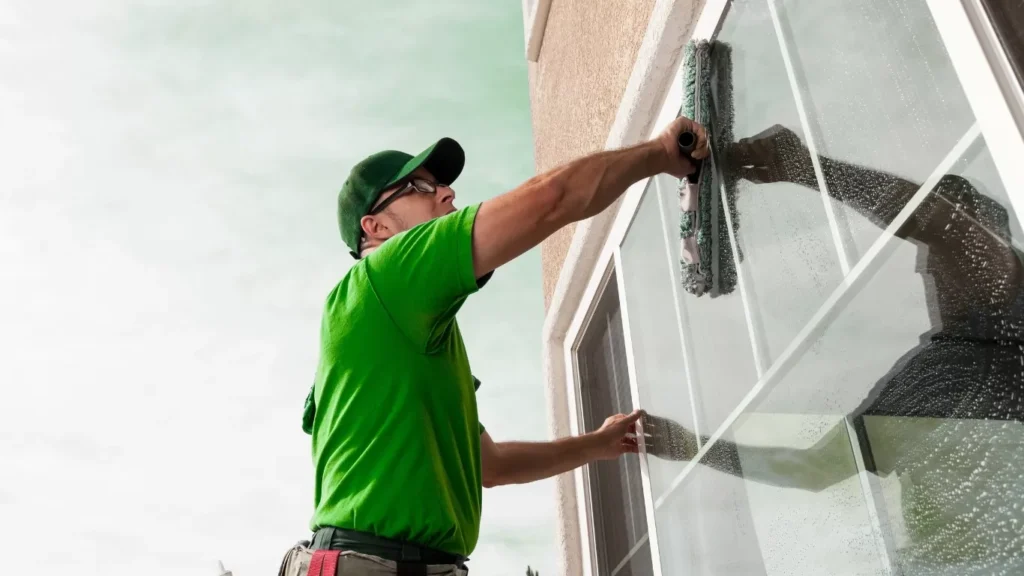 Professional team performing residential window cleaning