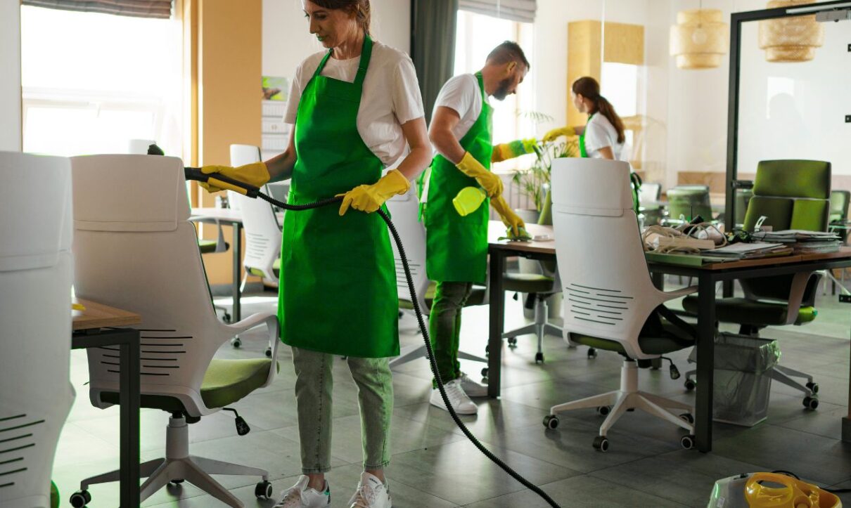Team performing best office cleaning services in a modern workspace.
