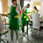 Team performing best office cleaning services in a modern workspace.