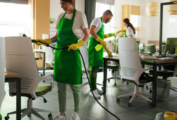 Team performing best office cleaning services in a modern workspace.