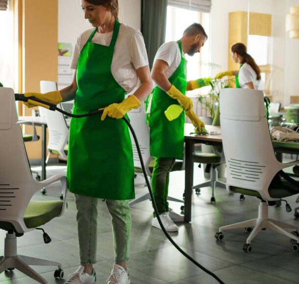 Team performing best office cleaning services in a modern workspace.