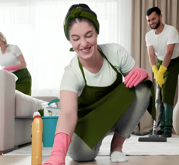 Professional team performing deep cleaning for apartment kitchen sanitization